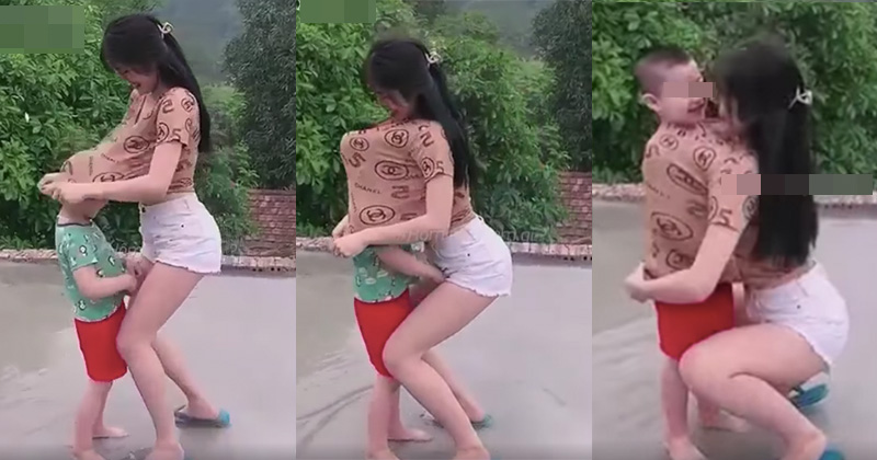 Cô gái đang cùng bé trai vui đùa thì có hành động bất ngờ khiến ai nấy đều phẫn nộ: Đừng đem con nít ra làm trò câu view - Ảnh 1.