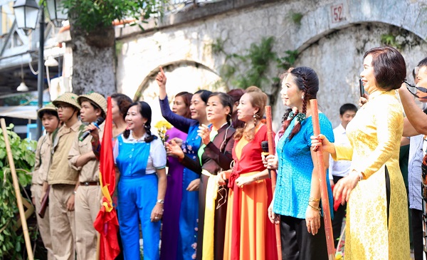 Hanoi mural street vibrant with national flags and flowers in celebration day