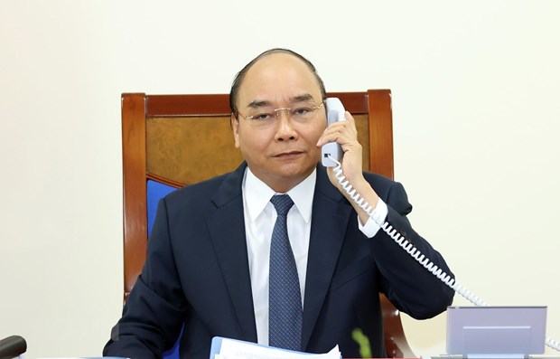 Vietnamese PM, German Chancellor hold phone talks hinh anh 1