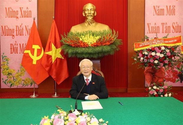 Vietnamese, Lao Party chiefs hold phone talks hinh anh 1