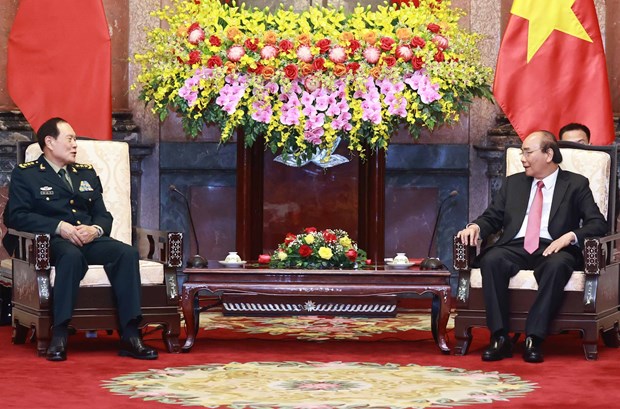 Armies’ successful ties help reinforce Vietnam-China relations: President hinh anh 1