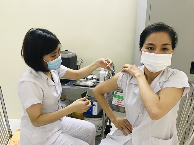 Over 966,000 doses of COVID-19 vaccine to be distributed nationwide hinh anh 1