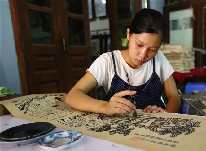 Dong Ho painting or Dong Ho folk woodcut painting is a genre of Vietnamese folk paining, stemming from Dong Ho village (Dong Ho commune, Thuan Thanh district, Bac Ninh province) (Photo:VNA)