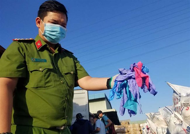 HCMC seizes two containers of used gloves imported from China