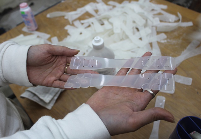 Charity group manufactures mask buckle to help relieve ear pain