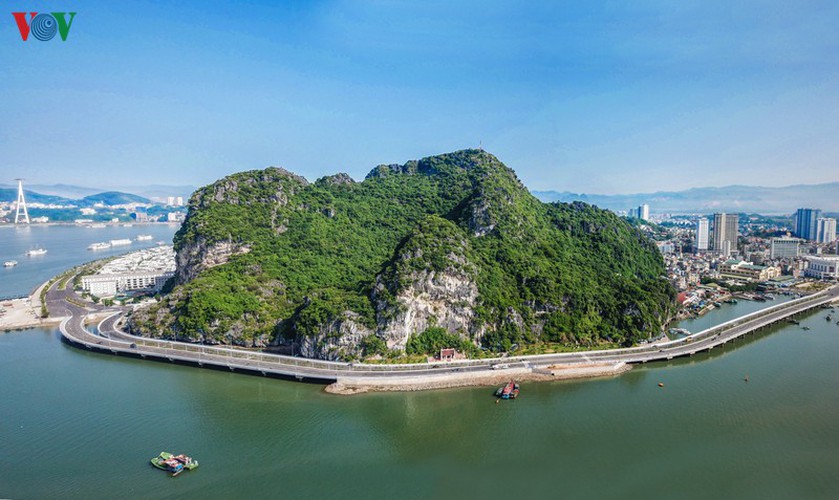 discovering scenic coastal road in ha long hinh 1