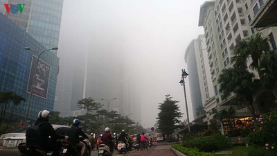 Dense fog descends on the streets of Hanoi