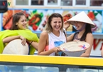 Foreigners enjoy scenic views onboard double decker buses in Ha Long