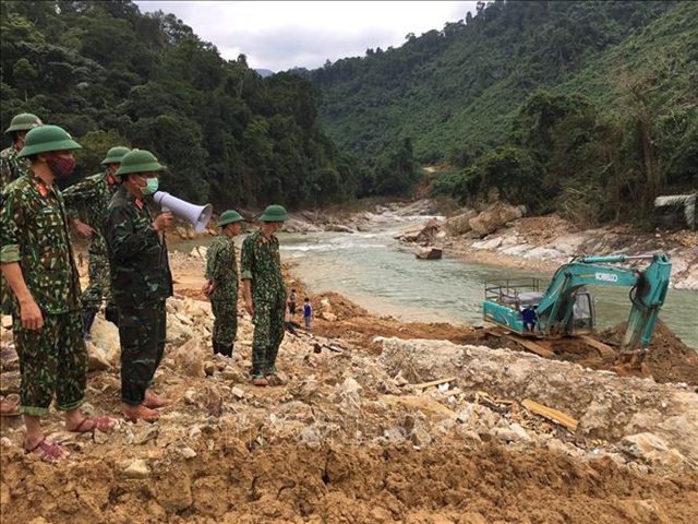 Rescue force discovers bodies of two workers, central region braces for typhoon