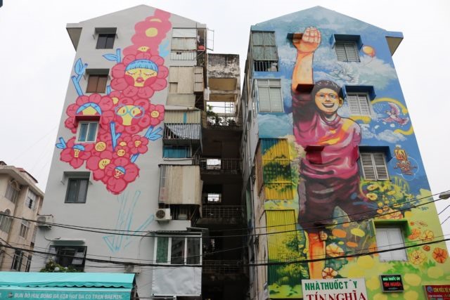 Colourful murals cover old buildings in HCM City