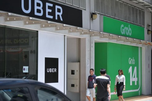 Thương vụ Grab mua Uber có thể bị hủy bỏ, Grab đối mặt với án phạt tài chính - ảnh 1