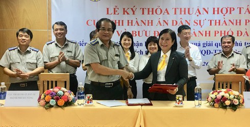 Bưu điện Đà Nẵng và Cục Thi hành án dân sự ký kết hợp tác nâng cao chất lượng dịch vụ hành chính công - ảnh 1
