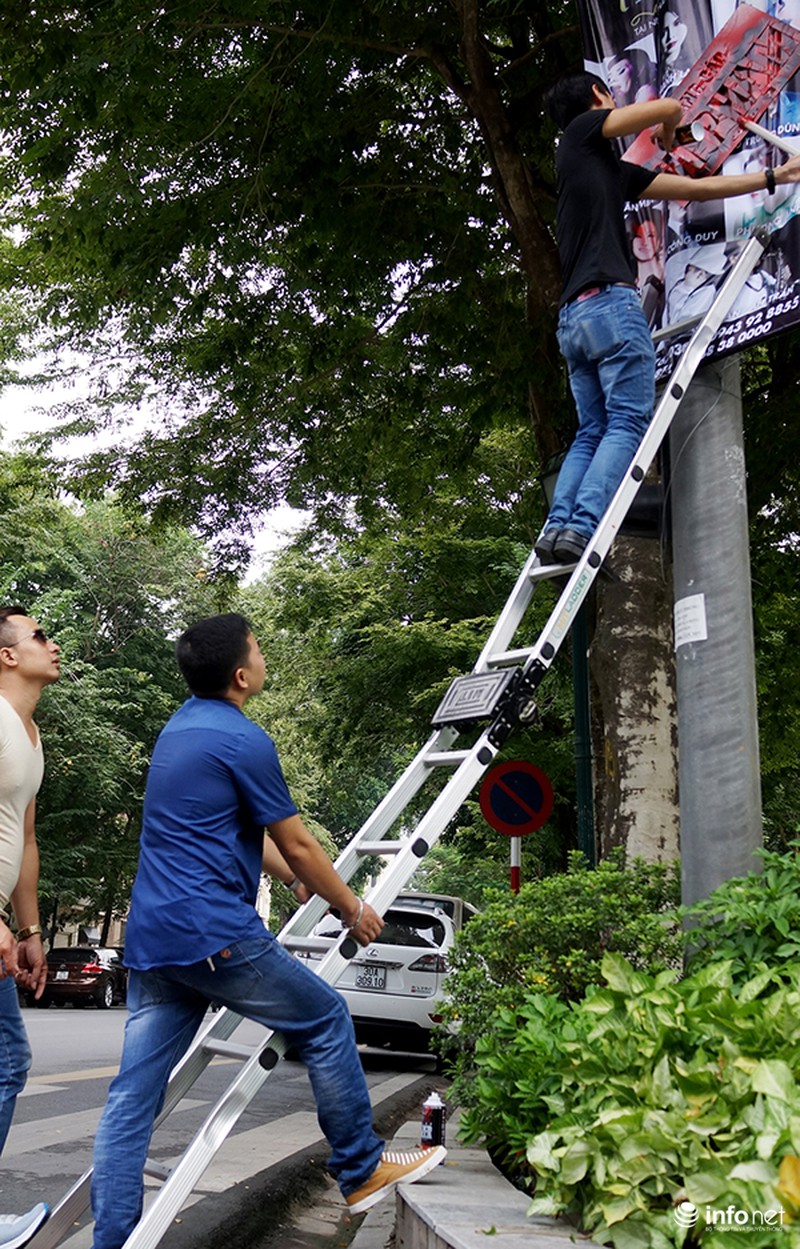Phun sơn thông báo vi phạm lên panô quảng cáo khắp đường phố Hà Nội - ảnh 2