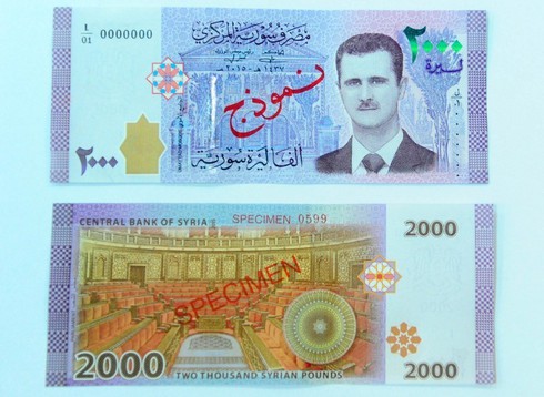 Ảnh Tổng thống Assad được in lên đồng tiền Syria - ảnh 1