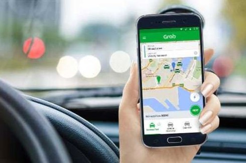Hiệp hội taxi TP.HCM: Quy định xe Grab phải gắn hộp đèn điện tử là minh bạch và công bằng - ảnh 1