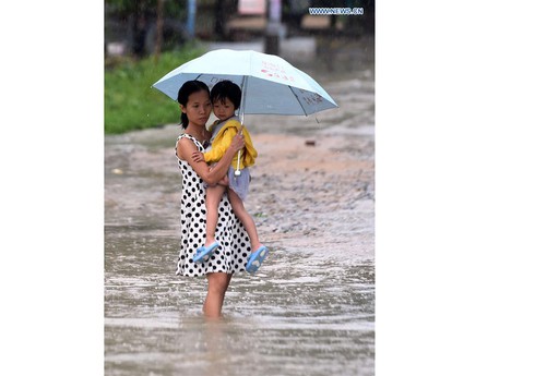 Những hình ảnh bão Dianmu đổ bộ vào Trung Quốc - ảnh 12