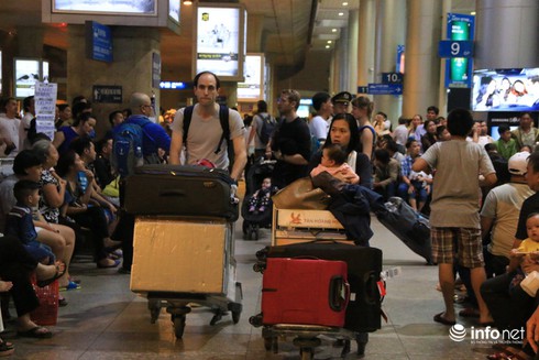 Kiều bào hối hả về quê ăn Tết - ảnh 11