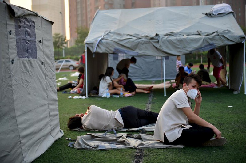 Ảnh vụ nổ kinh hoàng khiến hơn 400 người thương vong tại TQ - ảnh 9