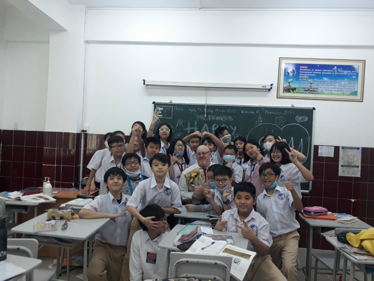 Francis (middle) and his students