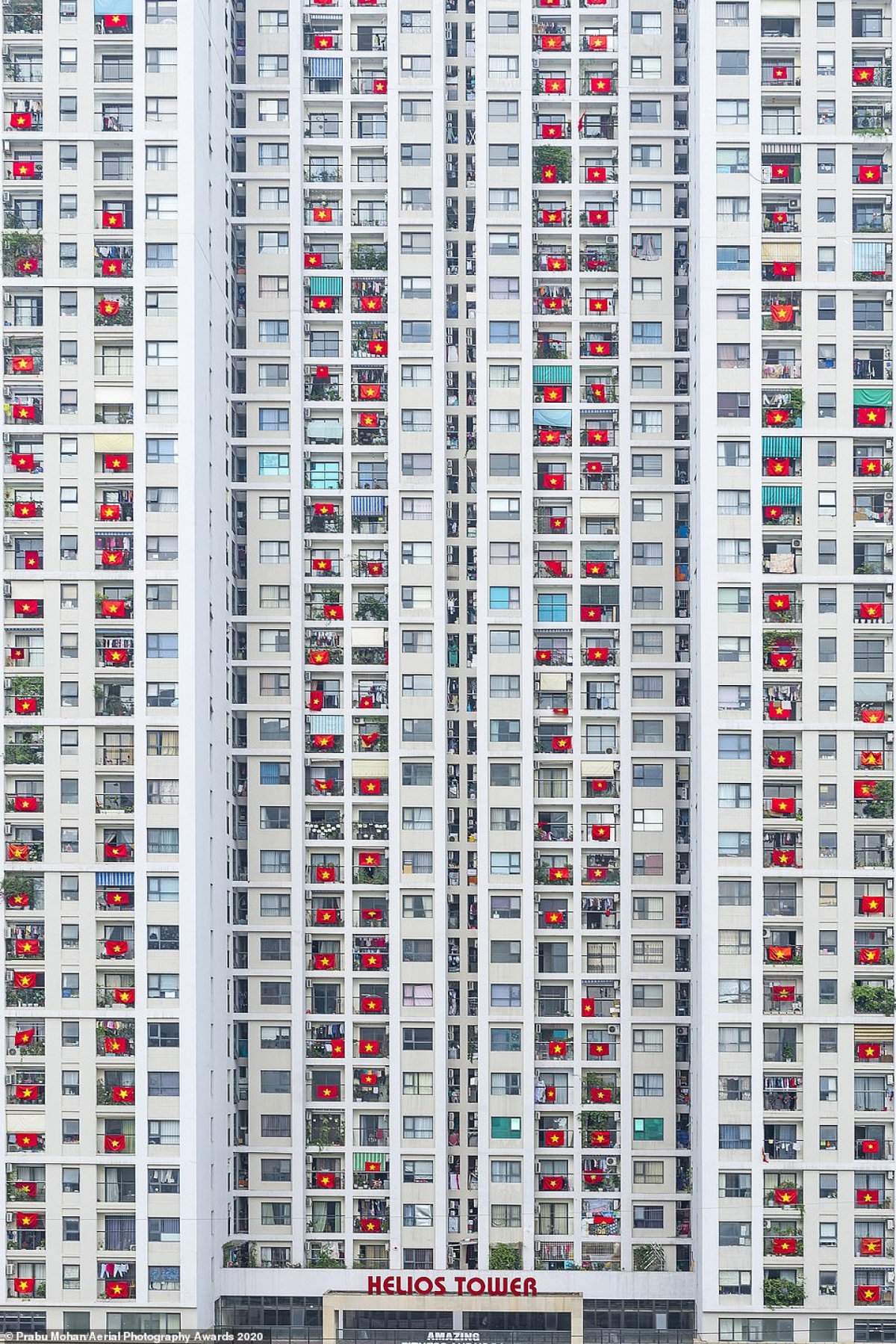 Among the World in Lockdown category a photo taken by Indian photographer Prabu Mohan was picked out by judges. He said, 'It is a residential apartment near my home [in Vietnam]. The residents hang their Vietnam national flags in support of those who are fighting on the front line against coronavirus.'