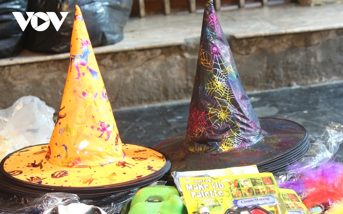 Colourful witch hats excite children viewing the festive items.