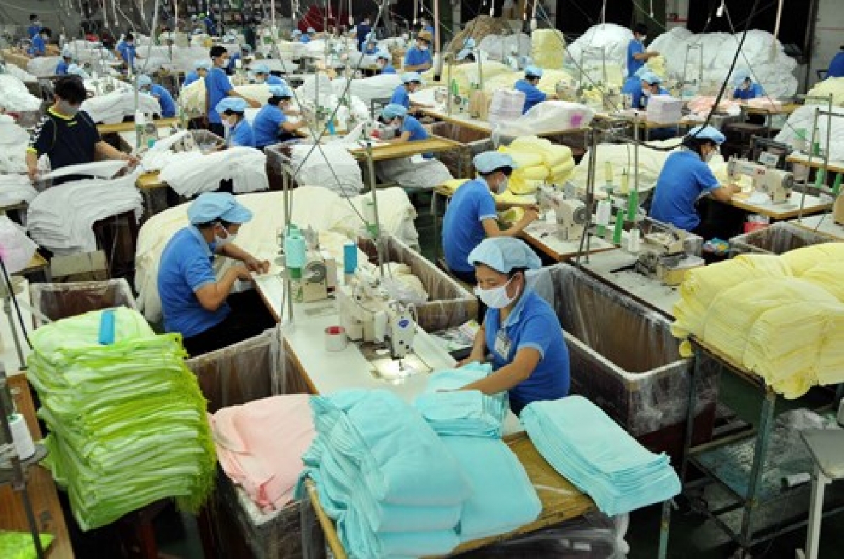 Workers at a textile factory in HCM City