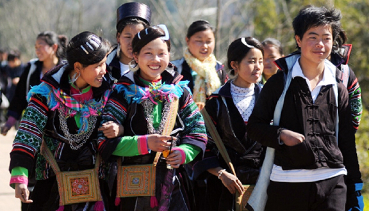 Mong boys and girls wear traditional clothing to festivals