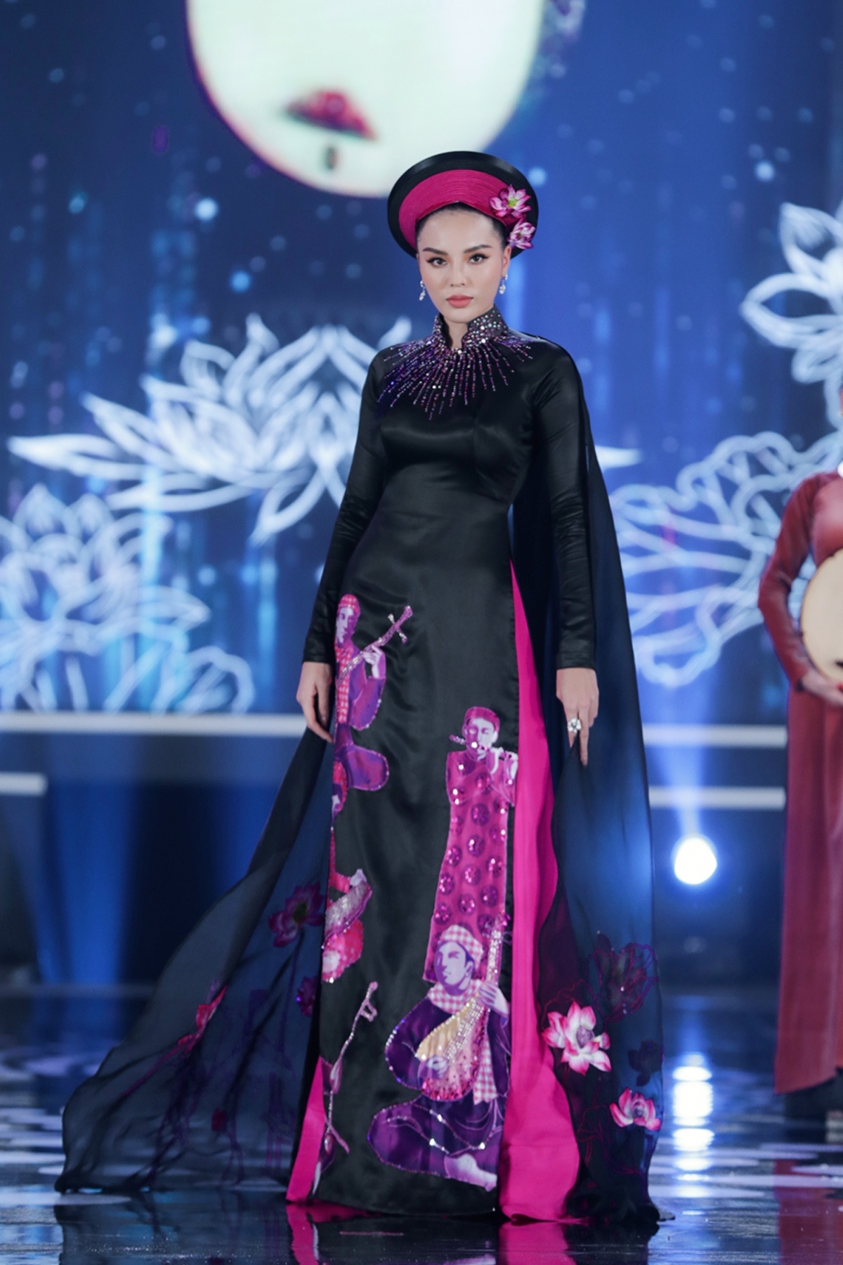 Ky Duyen, Miss Vietnam 2014 winner, appears in an Ao Dai inspired by Don ca tai tu, the musical art form recognised by UNESCO as an intangible part of local cultural heritage.
