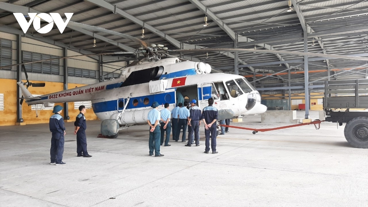 The helicopter takes off at Da Nang International Airport where emergency supplies have been stockpiled for delivery over the past few days.