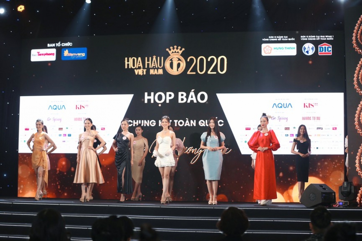 The 35 finalists to make the final stage of the contest model in cocktail dresses on stage.