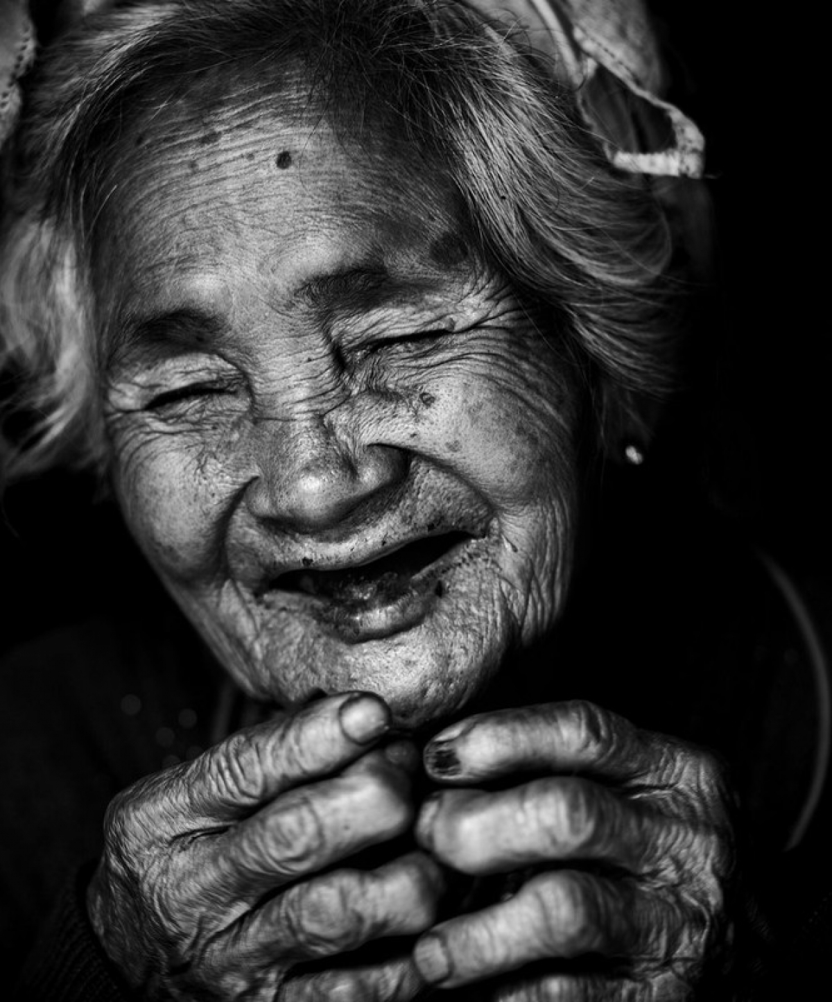 'Smile of Mom' by Vietnamese photographer @manhcuongvuong showcases an old person from the Raglai ethnic group in Khanh Hoa province as they cook.