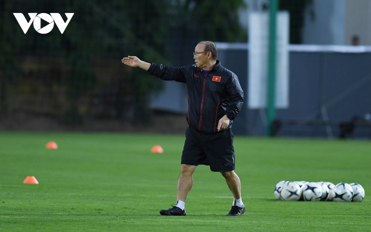 He continuously instructs the players on how to perform the correct movement.
